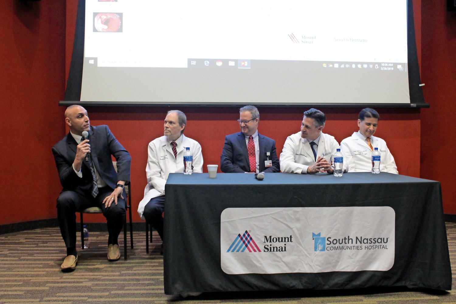 Merrick resident Eric Schrader, left, spoke about his experiences battling colon cancer. He was joined by Dr. Frank Gress, second from left, Dr. Frank Caliendo, Dr. Dean Pappas and Dr. Rajiv Datta, all of South Nassau Communities Hospital.