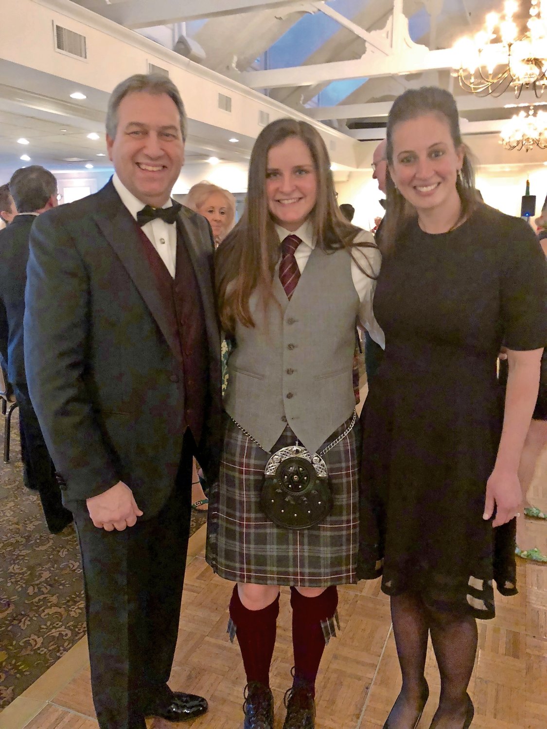Erin McGrath, center, was invited by Molloy College President Drew Bogner and Vice President of Student Affairs Janine Payton to create a pipe band on campus.
