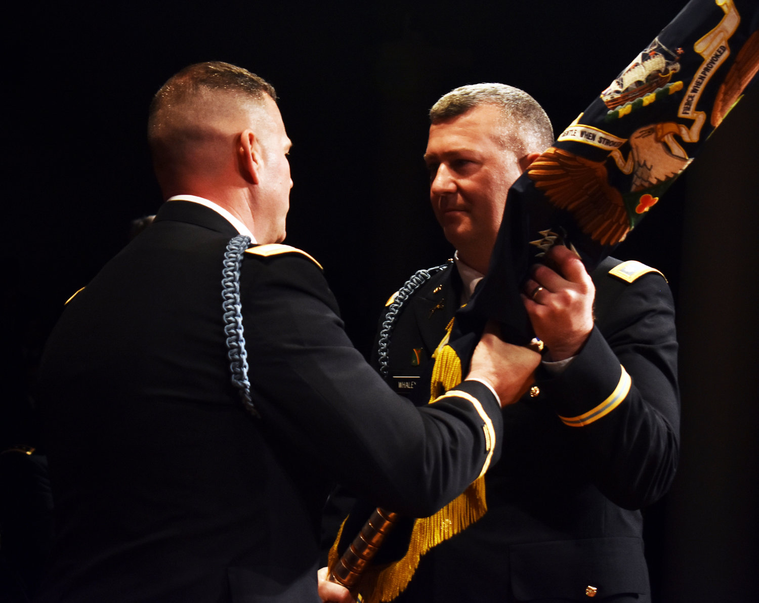 Lt. Col. Joseph Whaley, right, received the colors of the 1st Battalion, 69th Infantry from Col. Christopher Cronin, the commander of the 27th Infantry Brigade Combat Team, during change of command ceremonies held on March 16 at the Cooper Union in Manhattan.