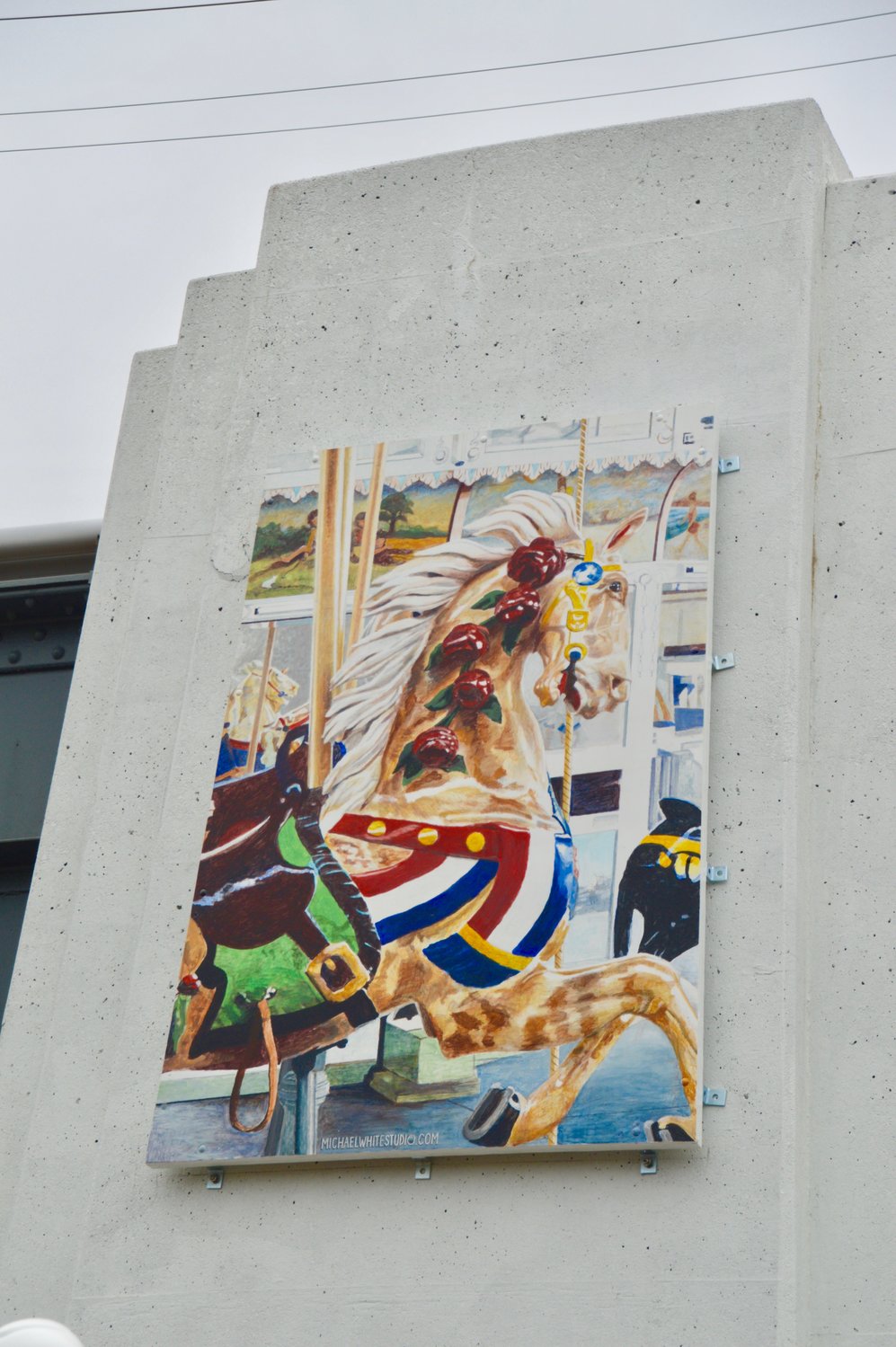 A mural of Nunley’s carousel, painted by Michael White, was mounted at Baldwin’s LIRR station on April 22.