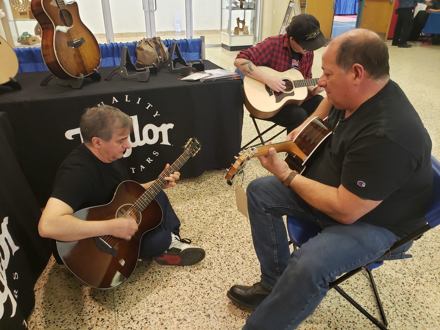 At the Taylor Guitars display, Freeporter Al Vinciguerra, right, was joined by O.J. Divietro, of East Islip, to jam out to Elvis Presley’s “Mystery Train” during the eighth annual New York Guitar Expo at the Freeport Recreation Center last Saturday.