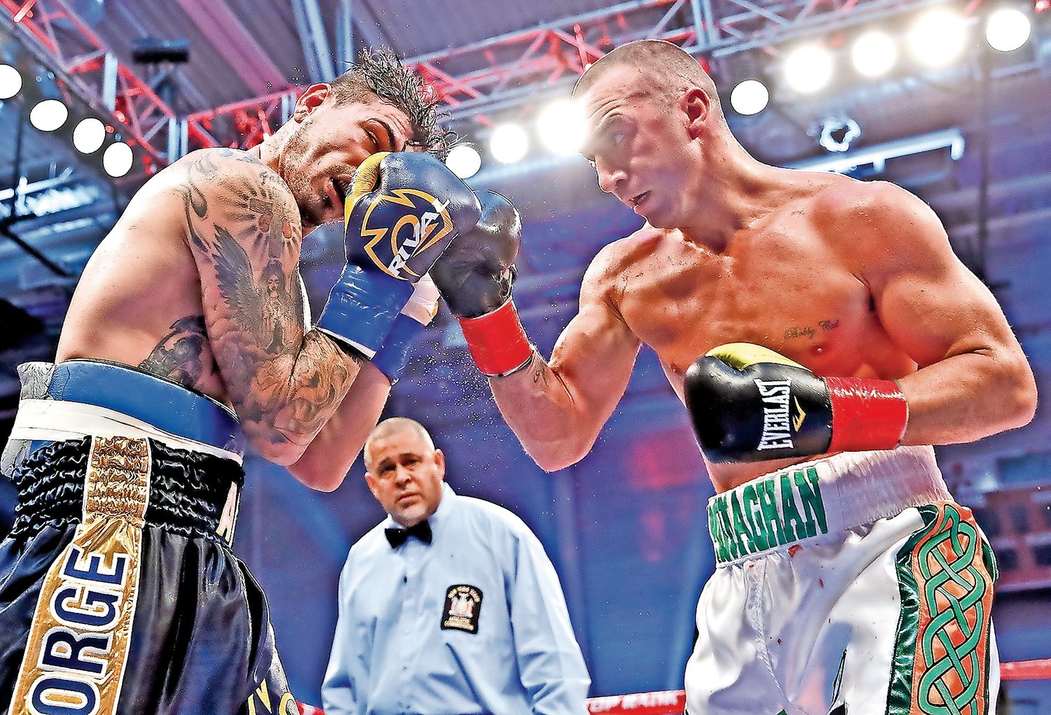 Seanie Monaghan, right, defeated Chicago’s Donovan “Da Bomb” George in 2015, and clinched the North American Boxing Organization light heavyweight title.