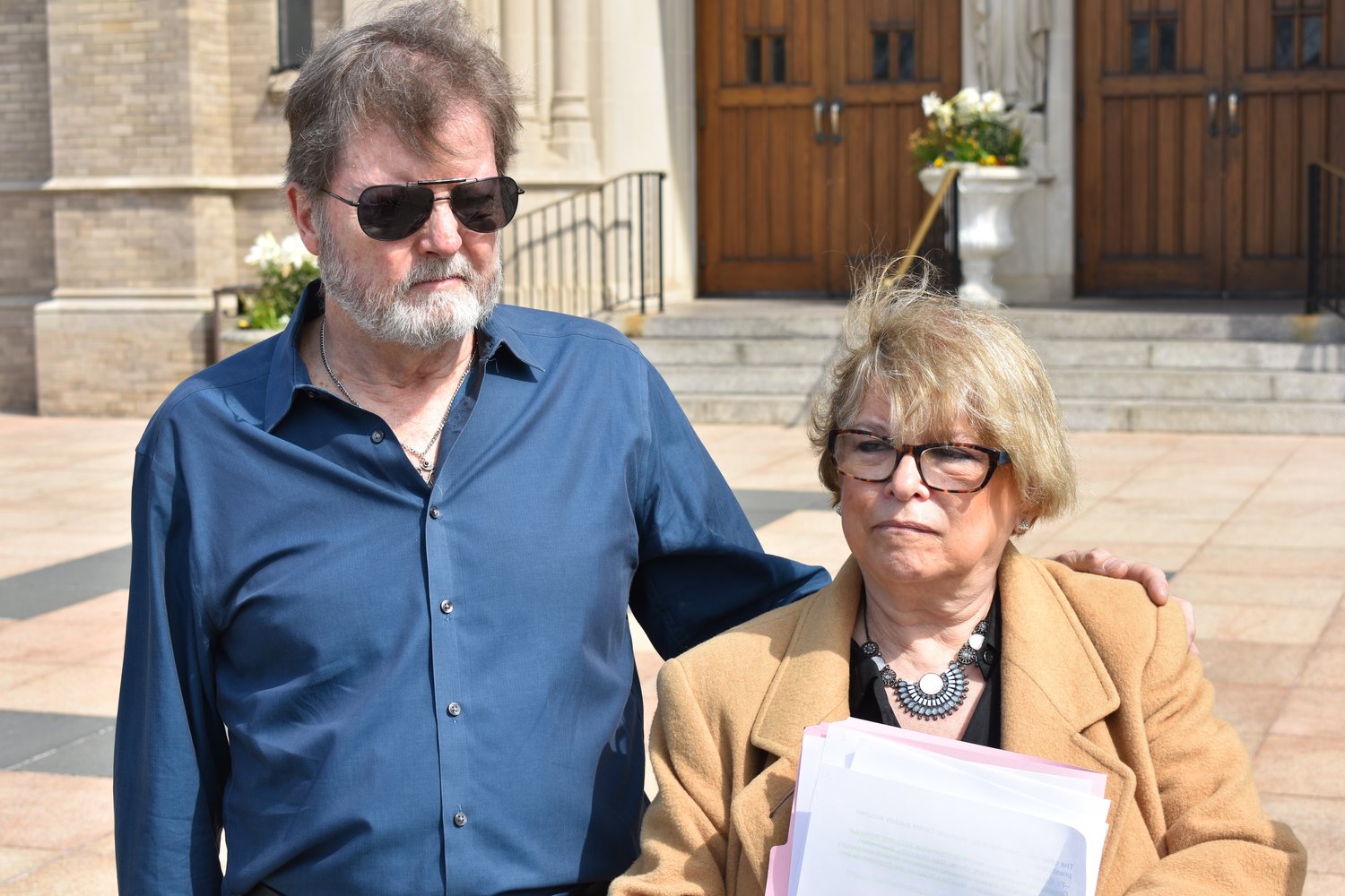 Brian Toale and Janet Klinger, who both said they were sexually abused when they were children, stood outside St. Agnes Cathedral on May 2, calling on the Diocese of Rockville Centre to release the names of accused priests.