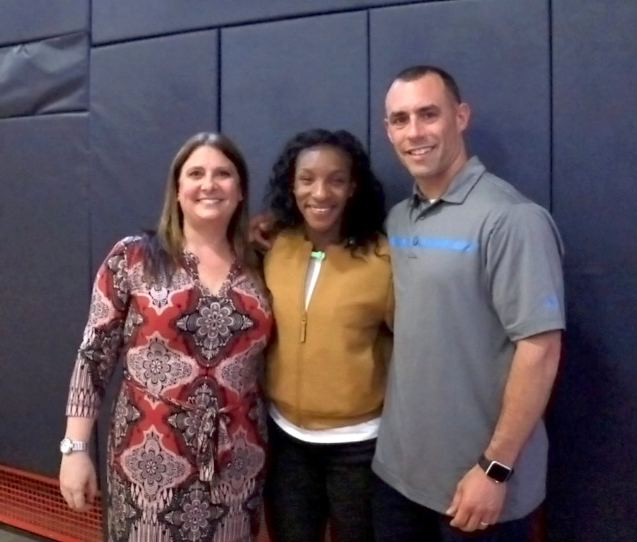 Crystal Dunn visited her former school counselor, Joanna Zweben, and teacher Brian Manolakes at South Side High School on May 2.