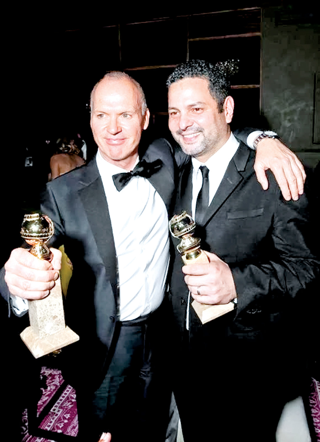Dinelaris, right, with “Birdman” star Michael Keaton in 2015 after they both won Golden Globes for their work on the film.