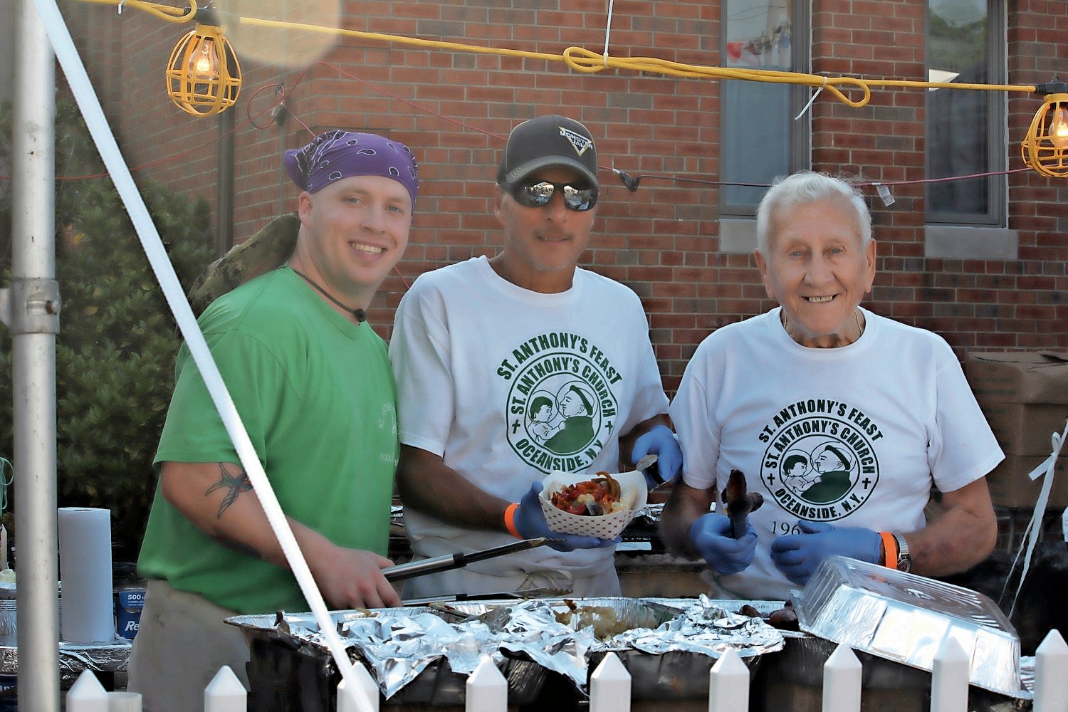 Volunteer Tony Ditizio, far right, started it all 50 years ago when St. Anthony’s Church hosted its first feast. He was joined by his godson, Dominic Albanese and Rich Giambrone at last year’s feast and is now preparing for the 50th in June.