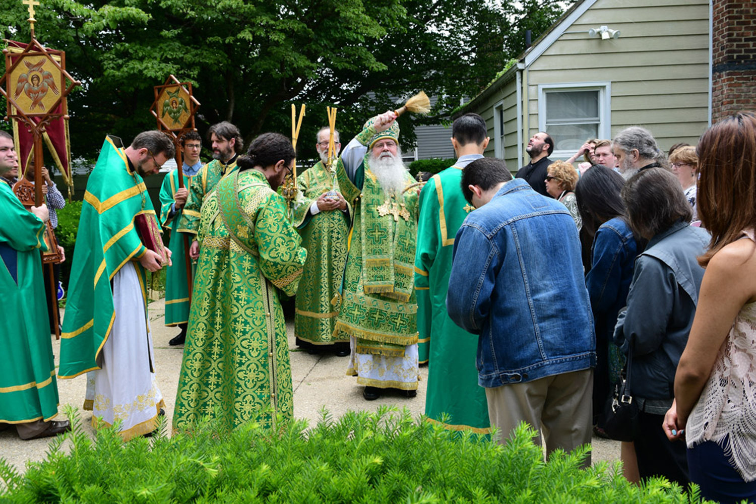 The metropolitan blesses with water.