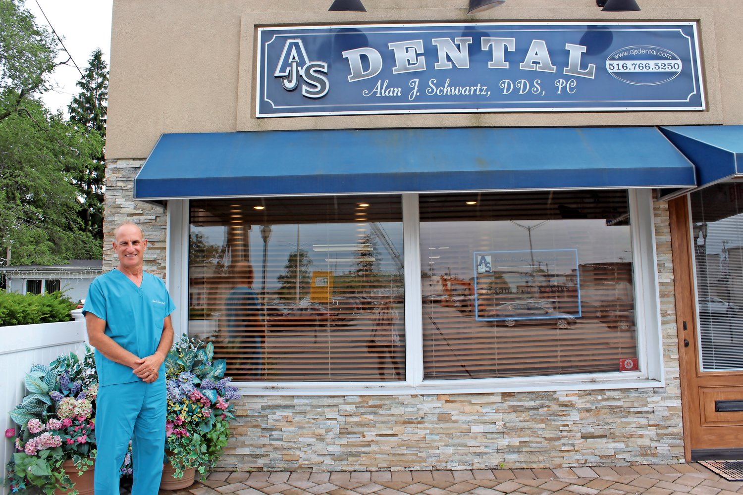 Alan Schwartz, a 1976 Oceanside High School graduate, has practiced dentistry in the hamlet for 10 years.