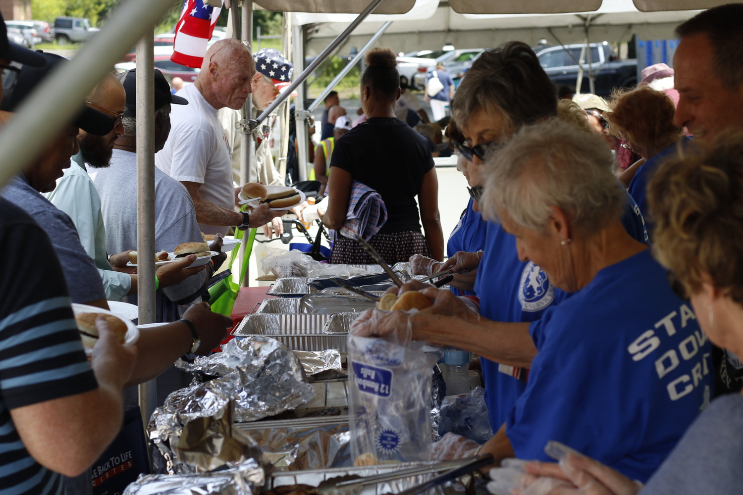 A barbecue was staffed by volunteers who called themselves the Stand Down Crew.