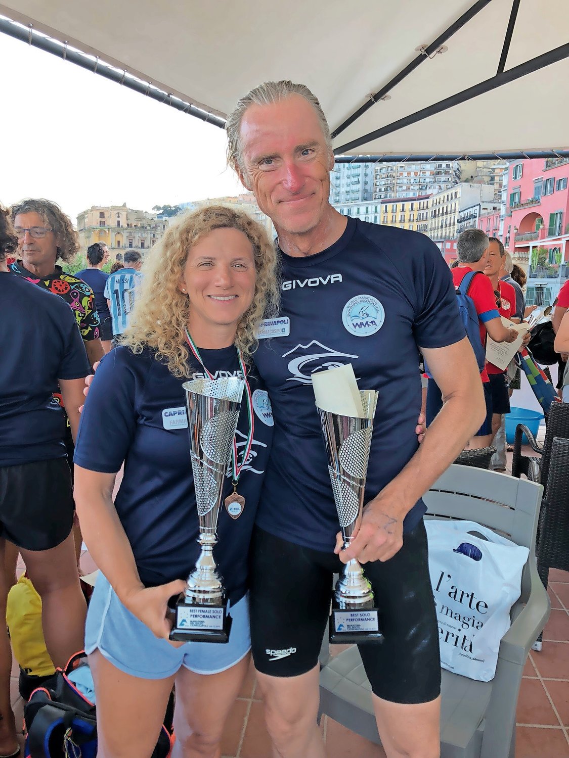 Rockville Centre resident Lori King finished second in the Maratona del Golfo in Italy on July 12. First-place finisher Olivier Delfosse, of Belgium, joined her.
