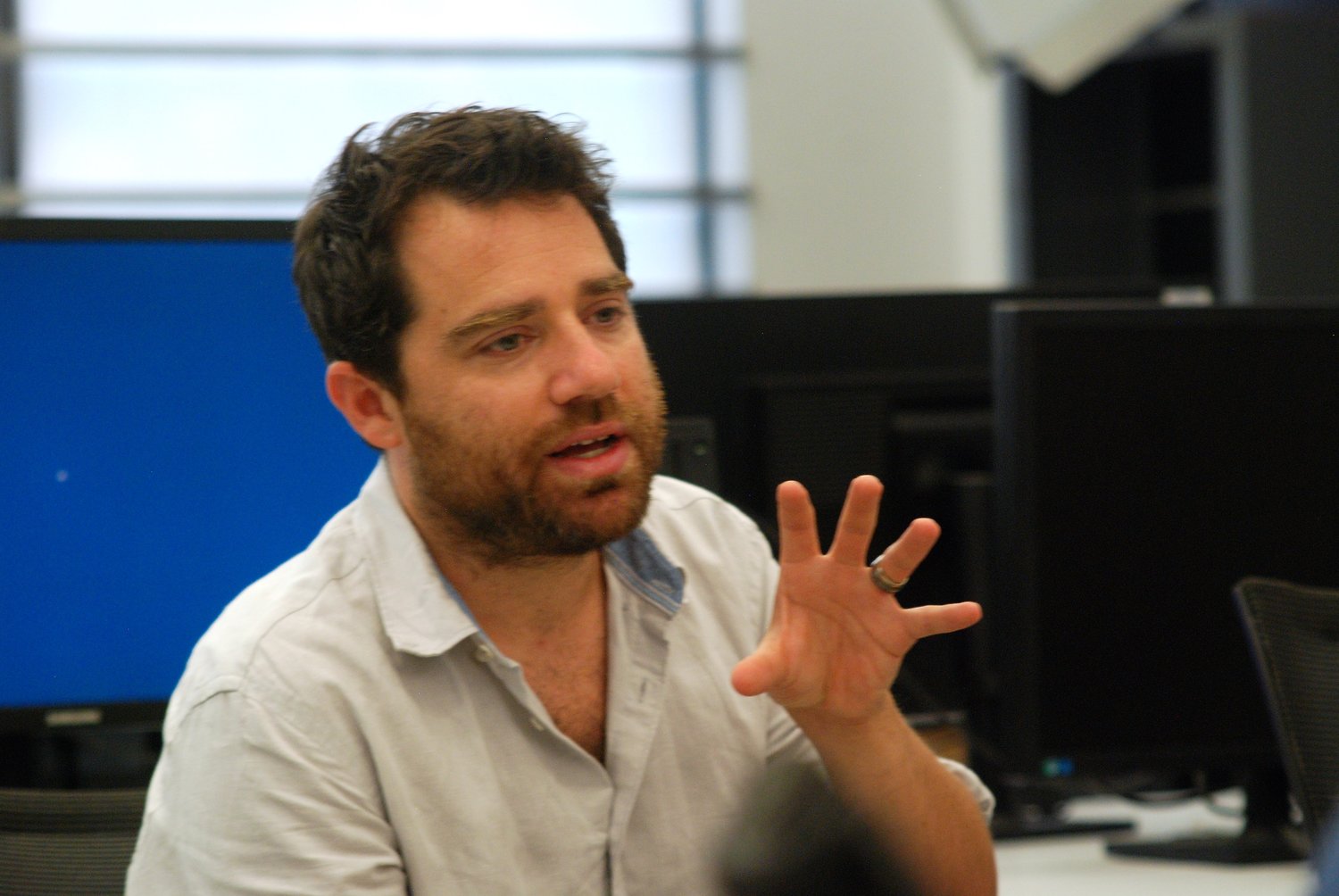 Author Michael Otterman, formerly of Merrick and Old Westbury, stopped by the Hofstra University Summer High School Journalism Institute on July 29 to discuss journalism with participants.