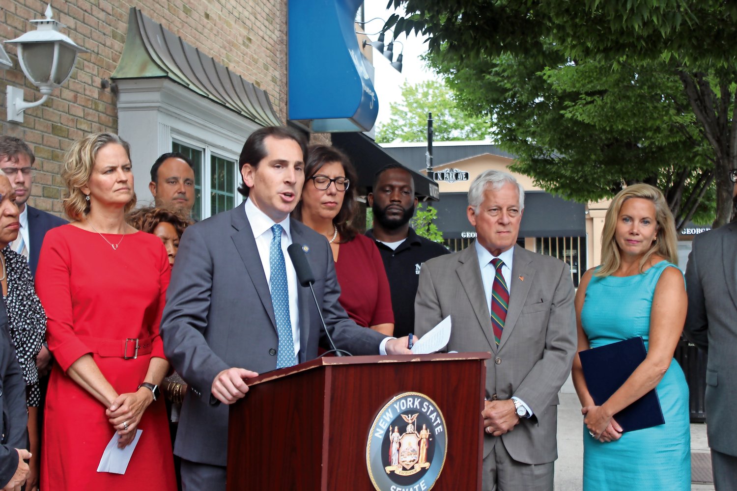 State Sen. Todd Kaminsky, center, and Assemblyman Charles Lavine, right, introduced legislation that would mandate education about the swastika and noose for students in grades six through 12.