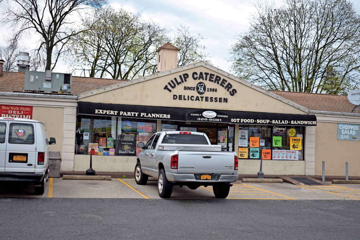 Tulip Caterers, at the intersection of Tulip Avenue and New Hyde Park Road in Franklin Square, will continue to stay in business, after the town zoning board unanimously voted against the necessary variances to build a 7-Eleven at the site.