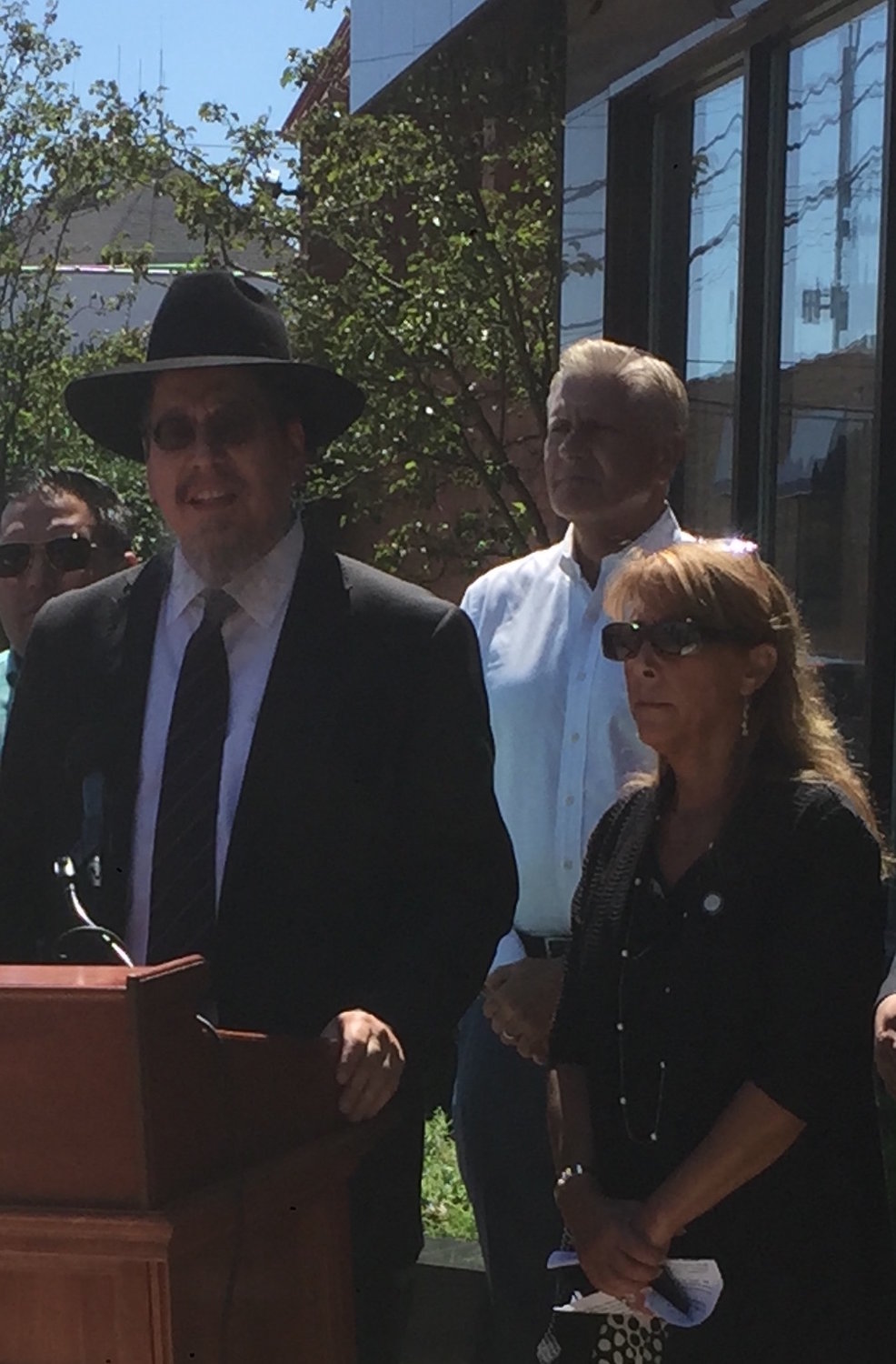 Mesivta Ateres Yaakov High School Head of School, Rabbi Mordechai Yaffe, center, said his school does not need oversight from the state on how to educate its students. To his left was State Assemblywoman Melissa Miller and in the back Councilman Bruce Blakeman.