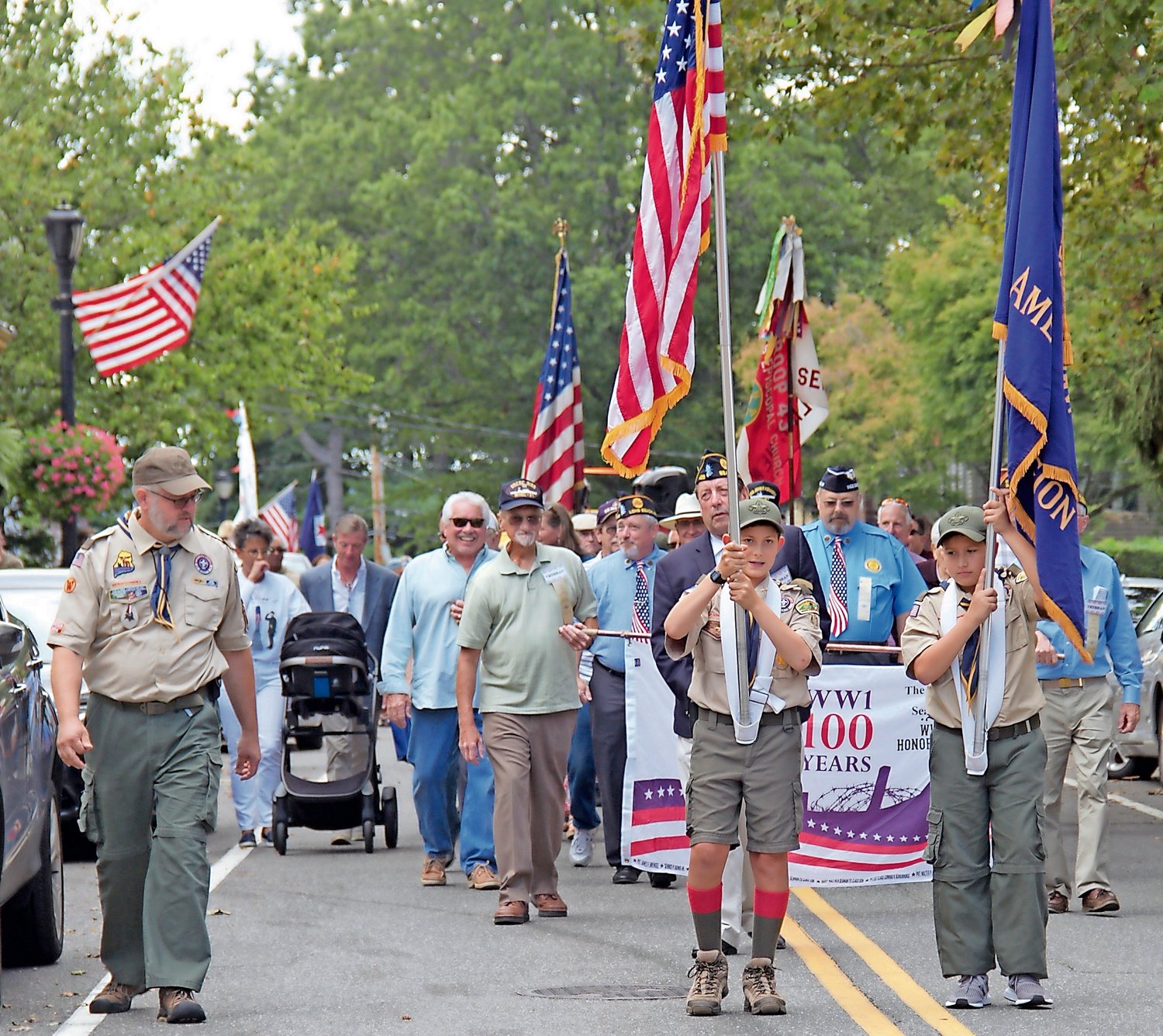 Boy Scout Troop 43 members Jared White, 12, front left, and Paolo Romito, 11, front right, led the parade.