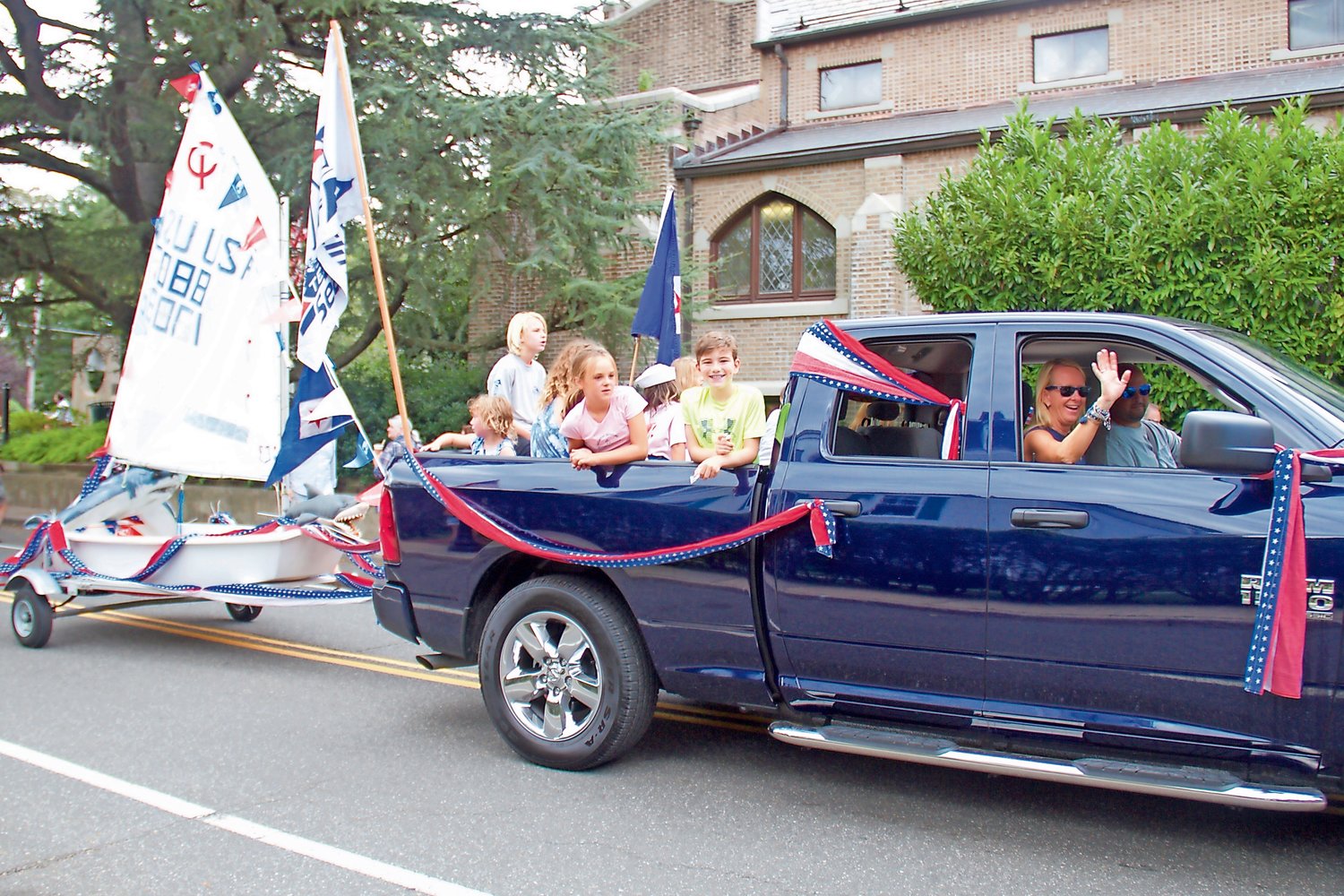 Locals decorated their cars and boats in red, white and blue for the parade.