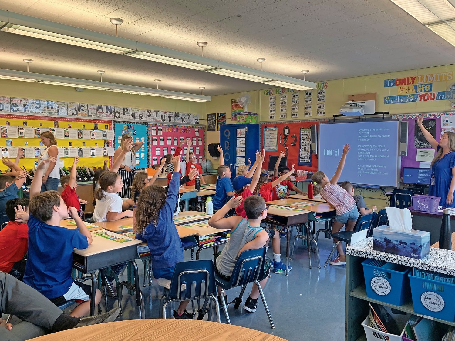 Samantha Jannotte, far right, led a class on mindfulness to elementary school students. As a new health and wellness provider, she will visit fourth and fifth grade classes throughout the year to teach students about maintaining mental and physical health.