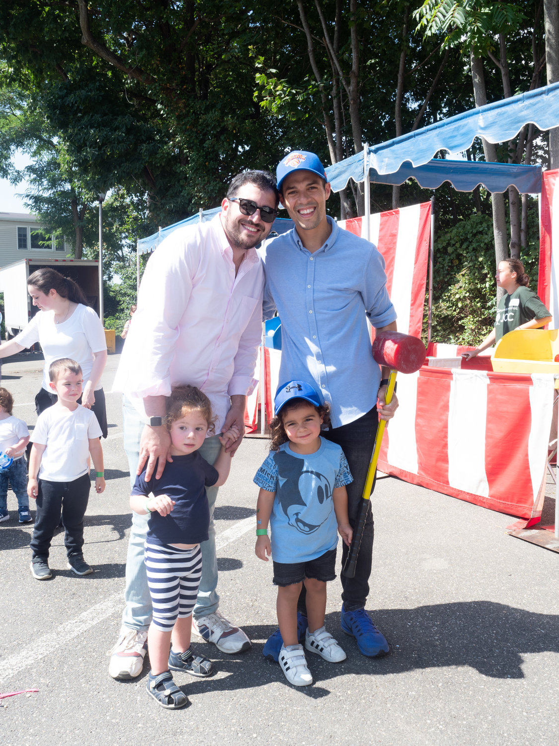 Families joined together at the JCC Fall Festival. Michael Nadjari and Nati Haboura with fathers, Jacob Nadjari, left, and Joseph Ouriel Haboura.