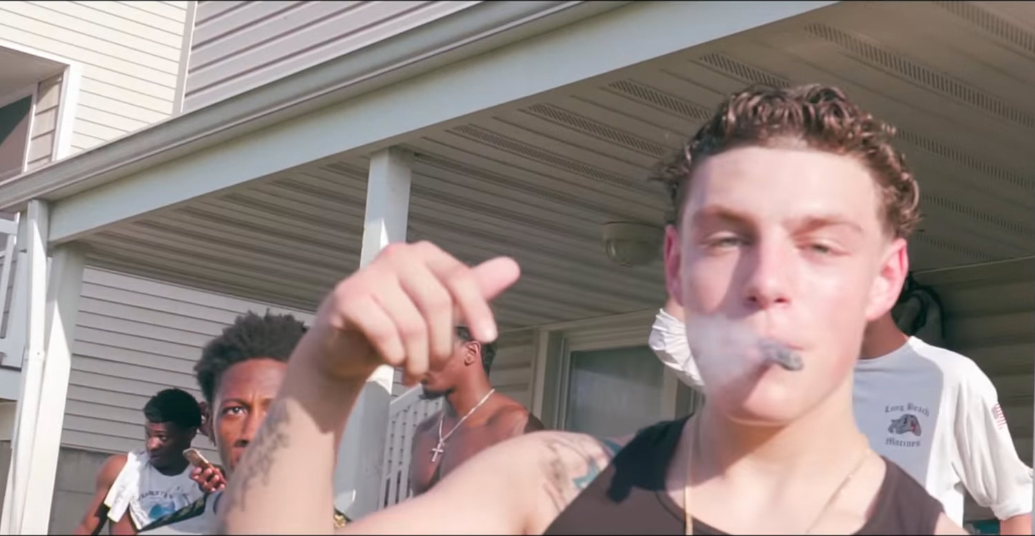 Tyler Flach, pictured in a rap video released in August that was shot in Long Beach, was charged with assault for allegedly beating a 15-year-old in Island Park in April.