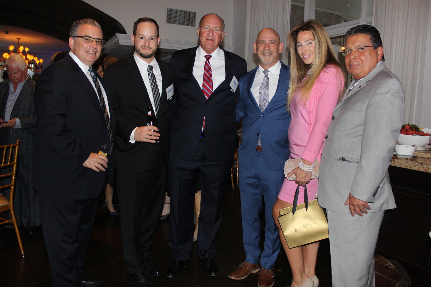 Mingling at the networking and cocktail party were, from left, Brett Harrison, Honoree Ross Kartez, Honoree Frederick Johs, Honoree Jeffrey Kimmel, Connie Henriquez and Frank Torres.
