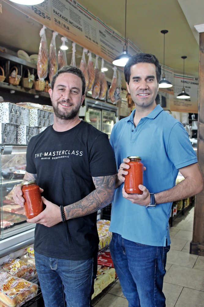 Business partners Anthony Giordano and Andrew Jedlicka displayed label-less bottles of Vinny Pastore’s Italian Sauce. The design will include Pastore’s signature.