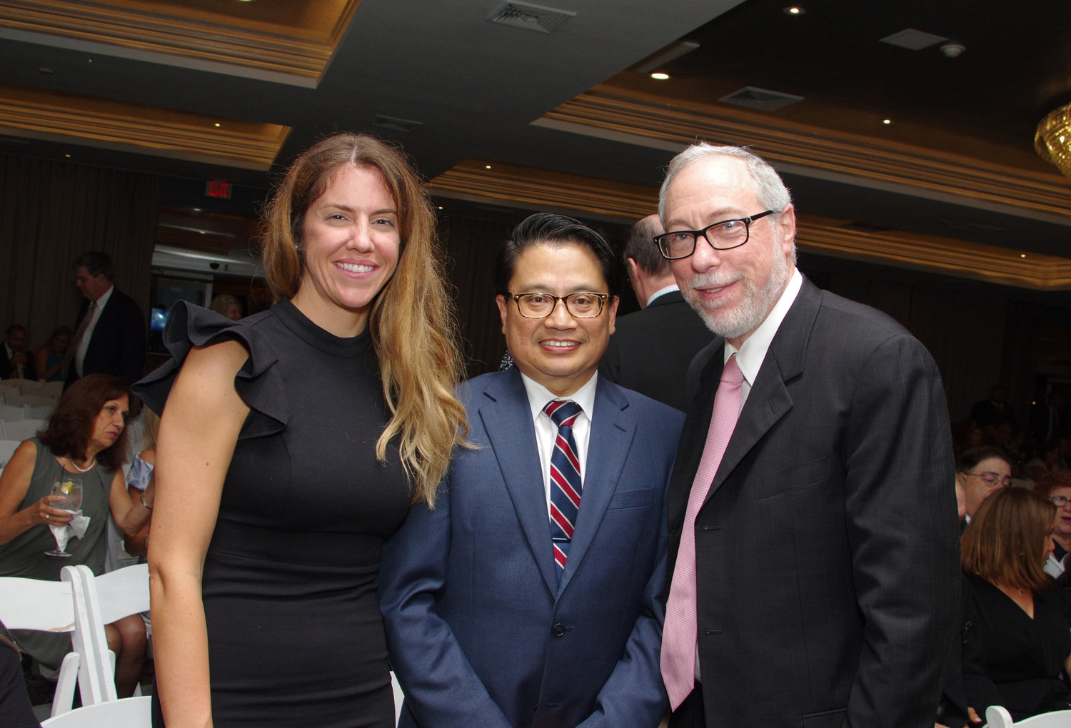 Mount Sinai South Nassau hospital hosted its annual Soiree Under the Stars gala on Sept. 28. Nurse Tracy Thorn, left, was recognized with the Cupola Award, while Dr. Ricardo Cruz, center, was honored with the Mary Pearson Award. Above, the two recipients with Department of Medicine Chairman Dr. Aaron Glatt.