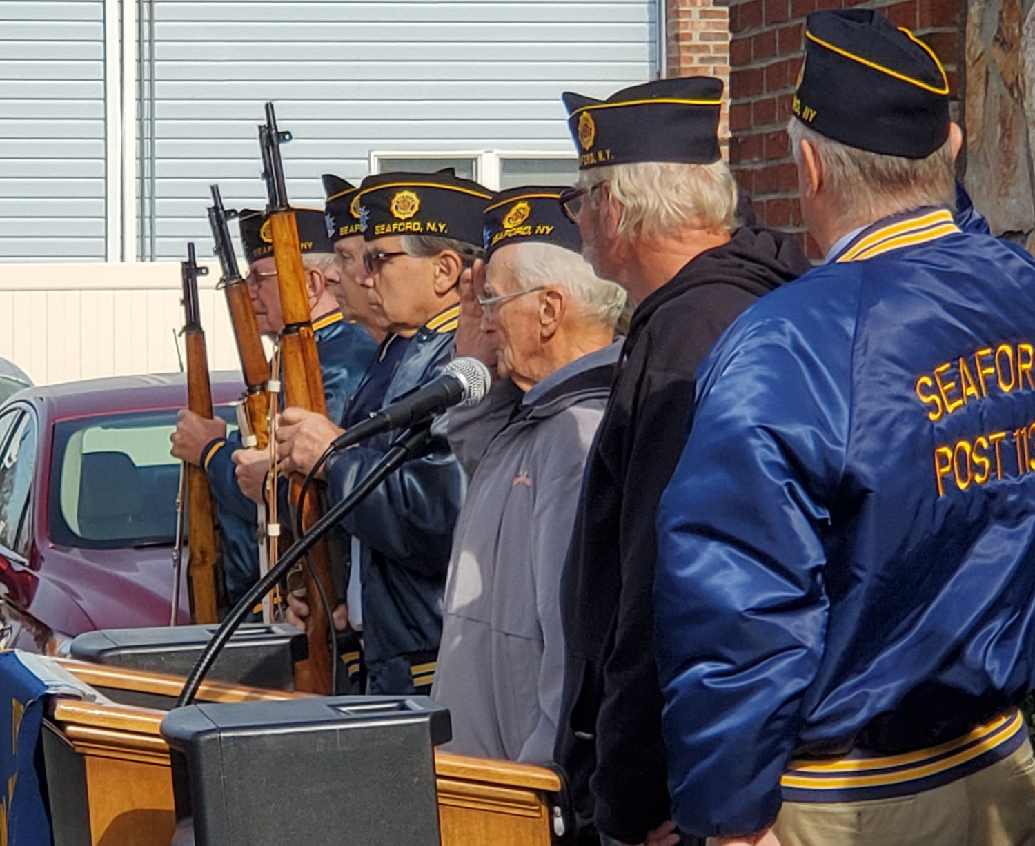 American Legion members shot blanks from rifles into the sky as the ceremony came to its conclusion.