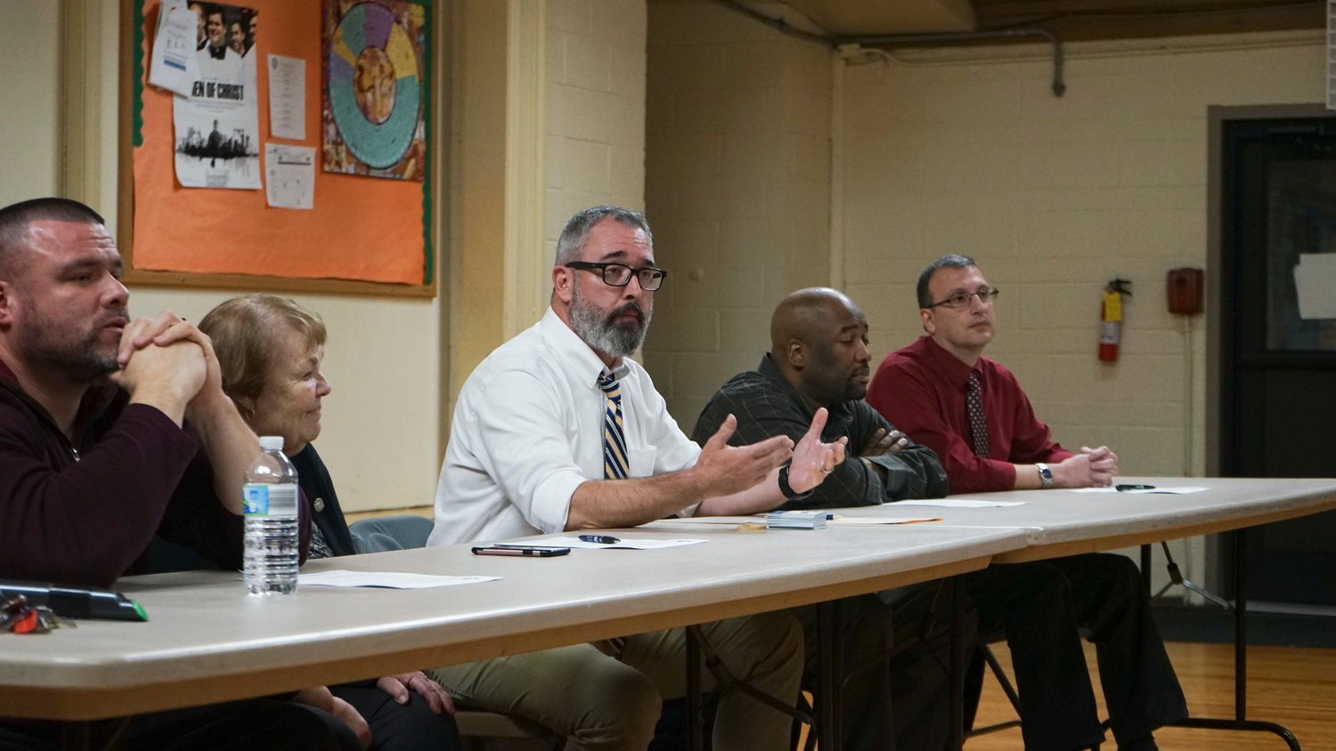 Joseph Trainor, center, executive director of the Martin De Porres Schools, addressed security concerns at a Nov. 6 meeting with Valley Stream residents.