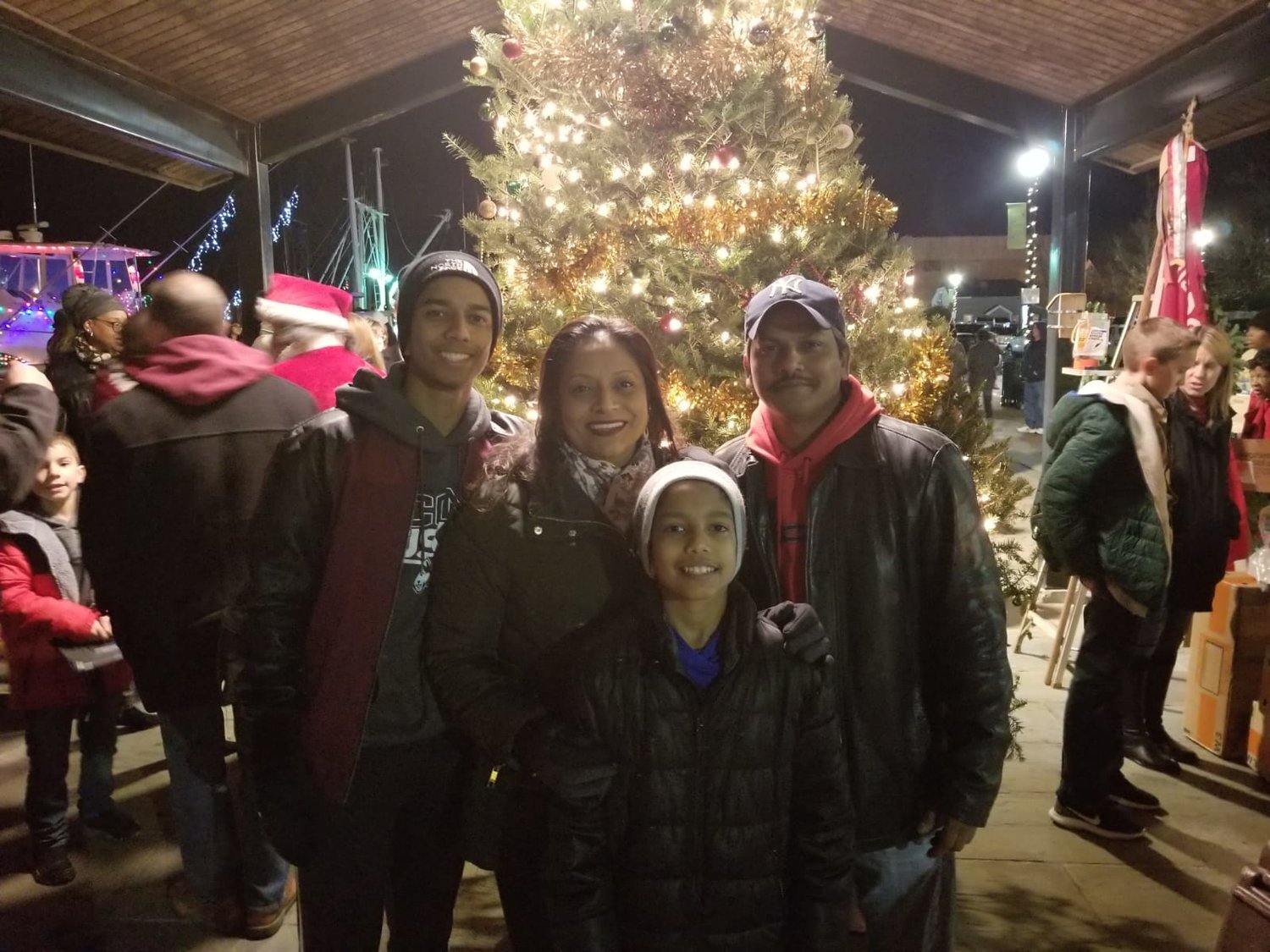 The Budhu family, Justin, left, Joanna, Jayden and John, right during the holiday seasons at the Esplanade on Woodcleft Avenue in Freeport.