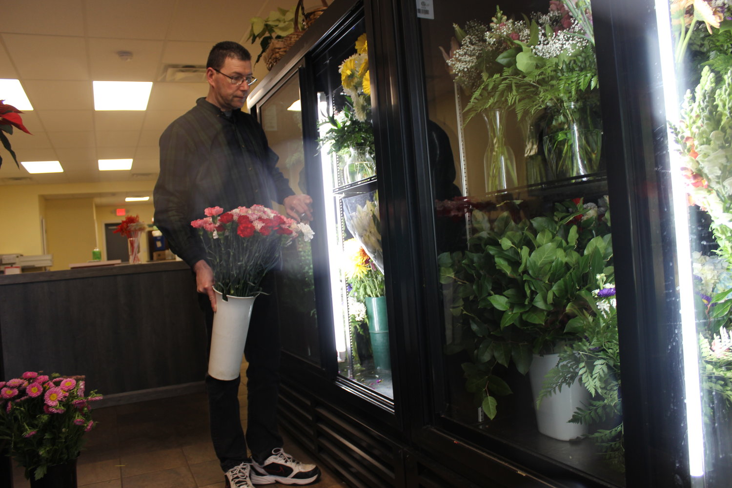 The East Meadow Florist has been in business since 1961, and Chris Hackert became its owner in 1996. Despite downsizing to a one-man operation two years ago, Hackert said he has a dedicated customer base, which shops for poinsettias and seasonal centerpieces for Christmas and Hanukkah.