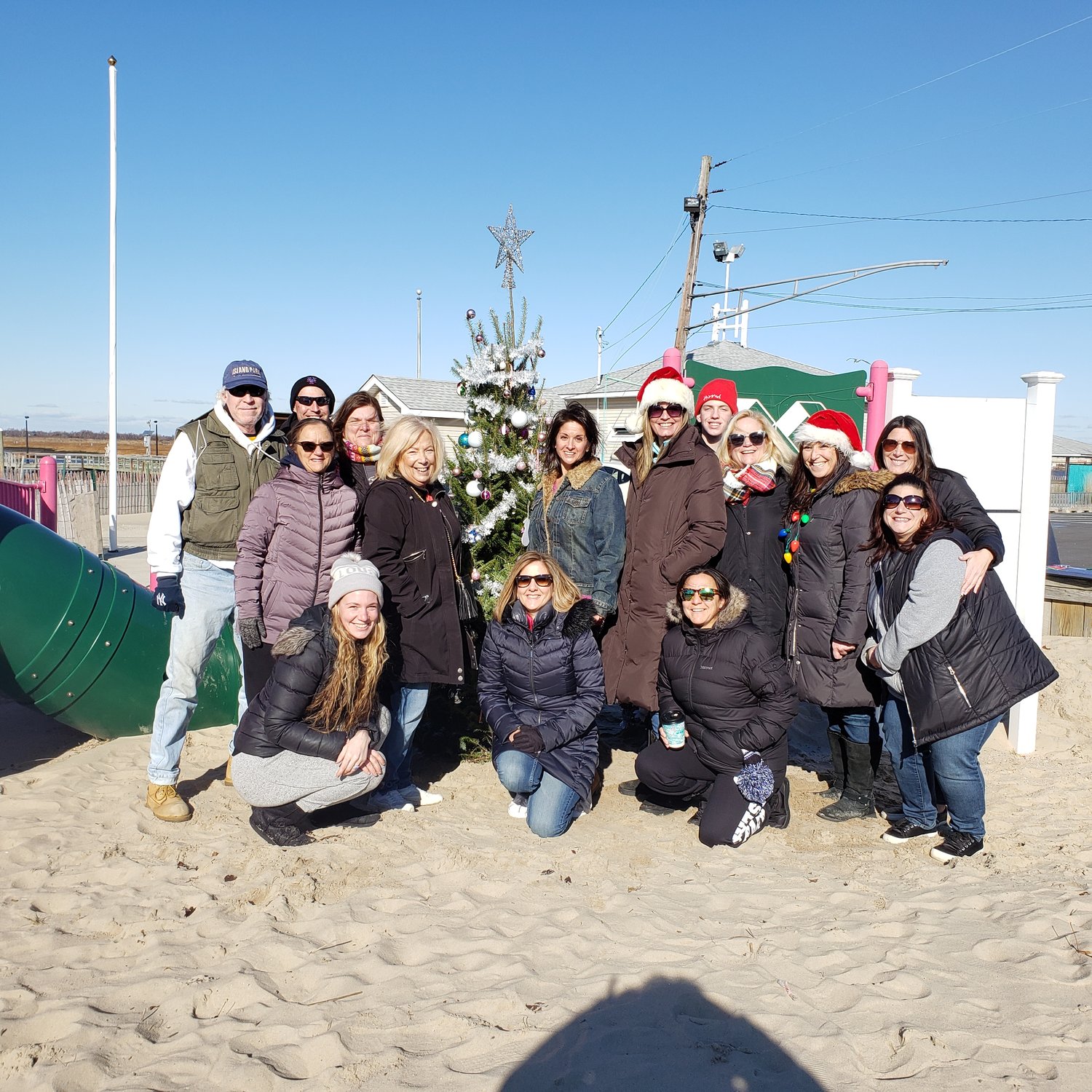 Dozens of community members came to Masone Beach on Saturday to honor Caroline Previdi, who was one of the victims in the Sandy Hook Elementary School shooting, and whom the playground at the beach was dedicated to.