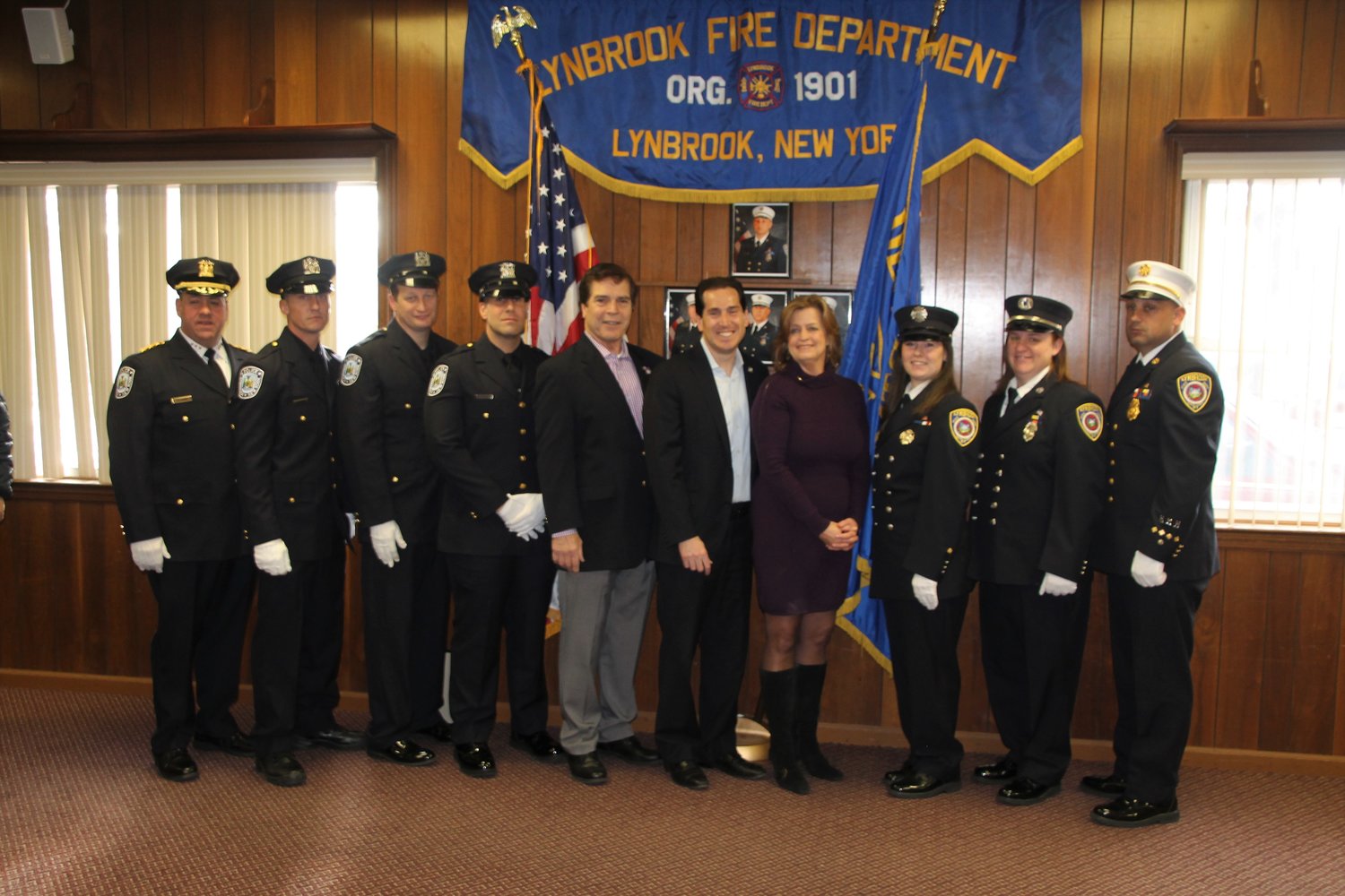 Lynbrook Police Chief Brian Paladino, far left, and Lynbrook Fire Chief Nick Pearsall, far right, joined their department members, Beach, Kaminsky and Griffin during the presentations.