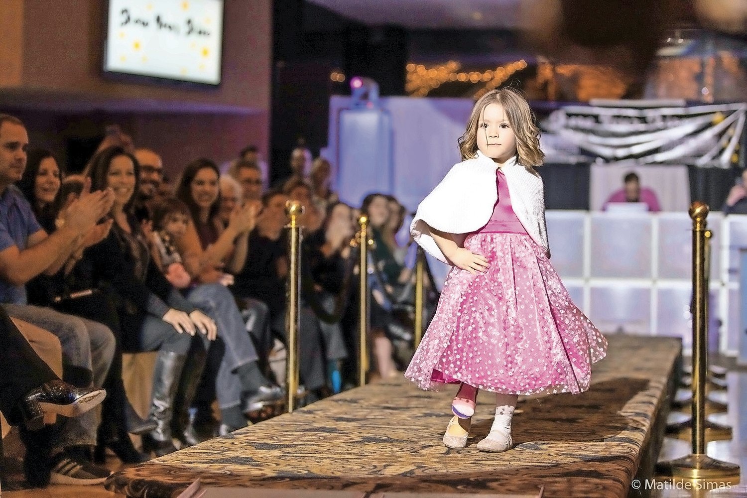Aurora Browne, 5, of Newark Valley, N.Y., walked the runway at the “Show Your Shine” event in Oceanside on Jan. 11.