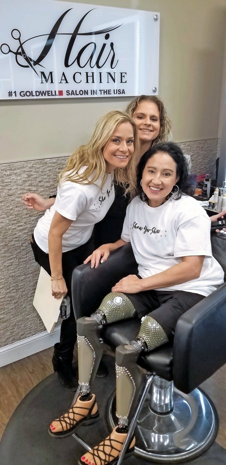 Smith, of Rockville Centre, left, joined make-up artist Jennifer Jaksic at Hair Machine as she did make up for Yvonne Llanes, 51, of San Antonio, T.X. before Llanes hit the runway.