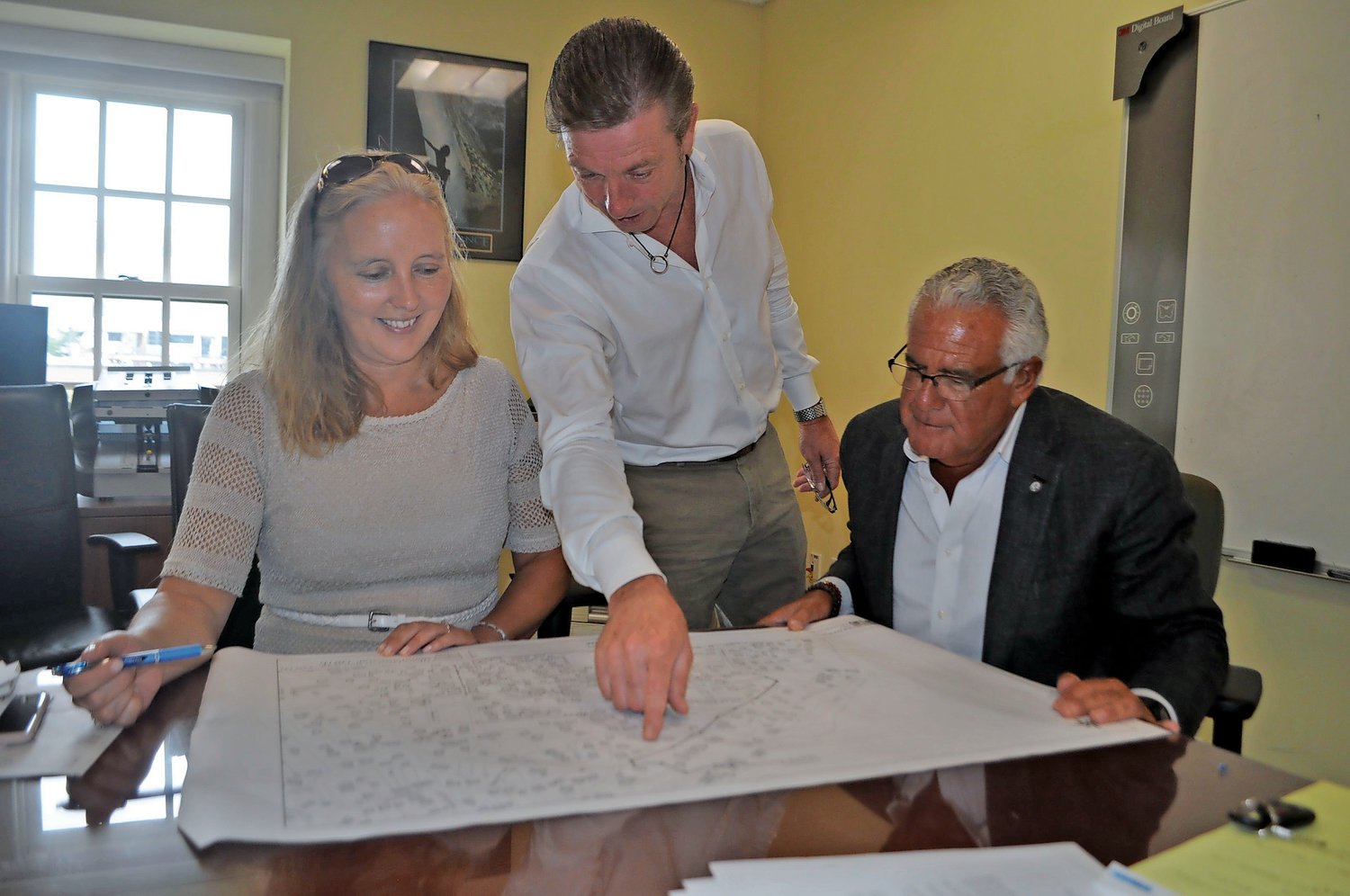 Nassau County Legislator Delia DeRiggi-Whitton, Sea Cliff Village Administrator Bruce Kennedy, center, and Sea Cliff Mayor Edward Lieberman have spent much of the last year and a half reviewing plans for Sea Cliff’s sewers.