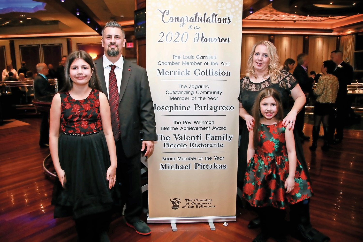 Board Member of the Year Michael Pittakas, second from left, with his wife Rosanna, right, and daughters Sofia, left, and Annabella.
