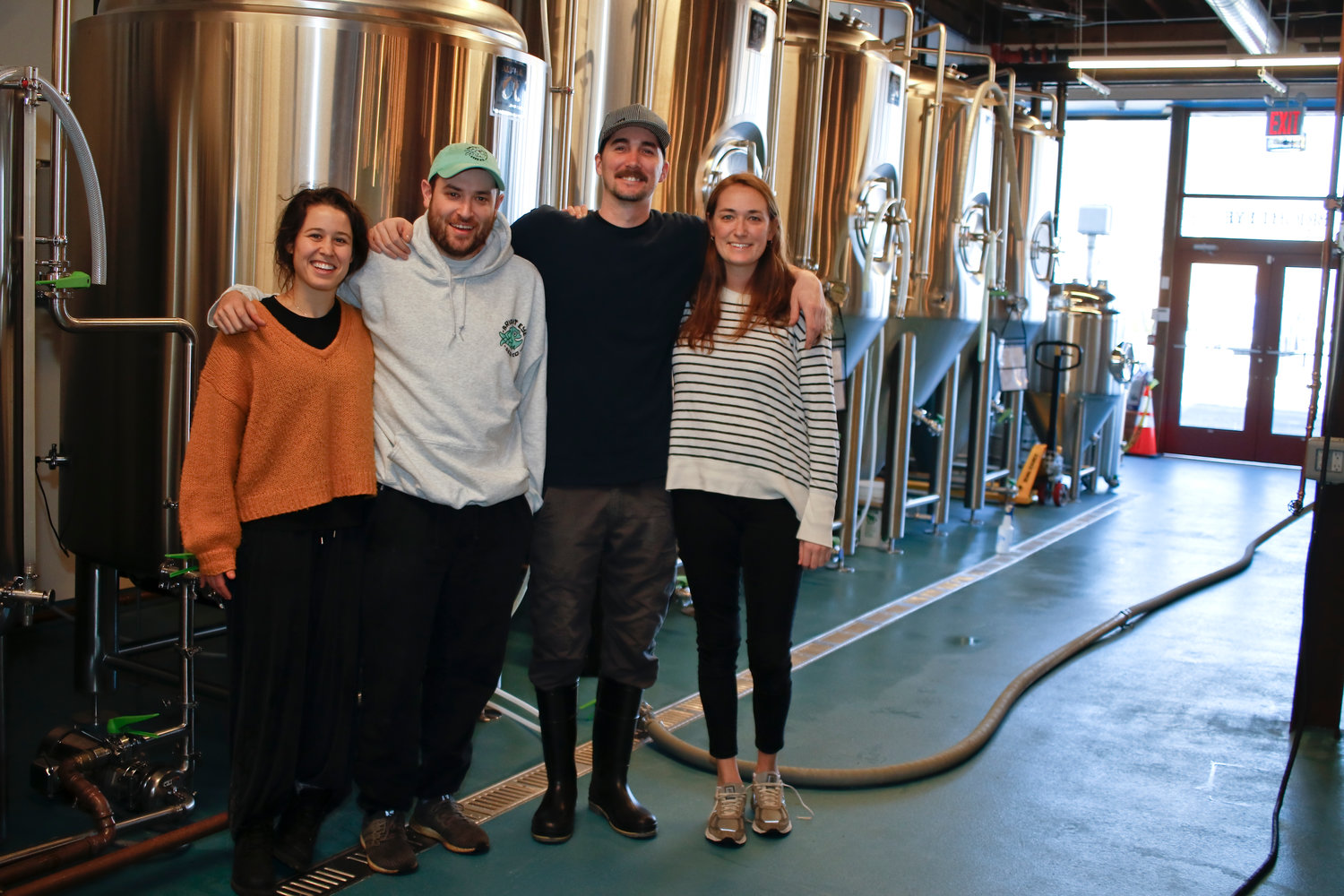 Bright Eye Beer Company owners Molly Allare, far left, Luke Heneghan and Keira Heneghan, far right, with Head Brewer Brendan Maxim.