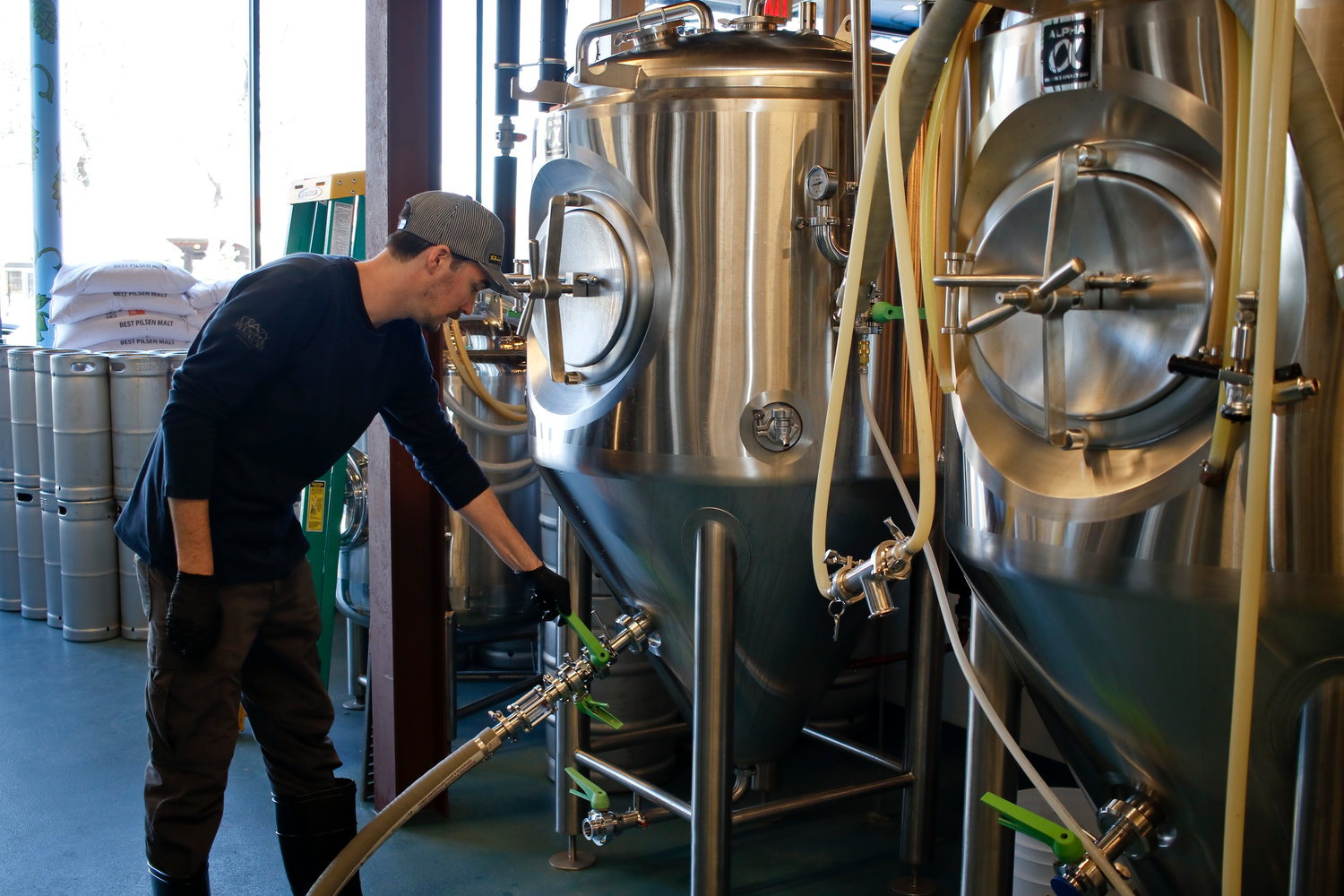 Head Brewer Brendan Maxim transfered beer to another barrel.