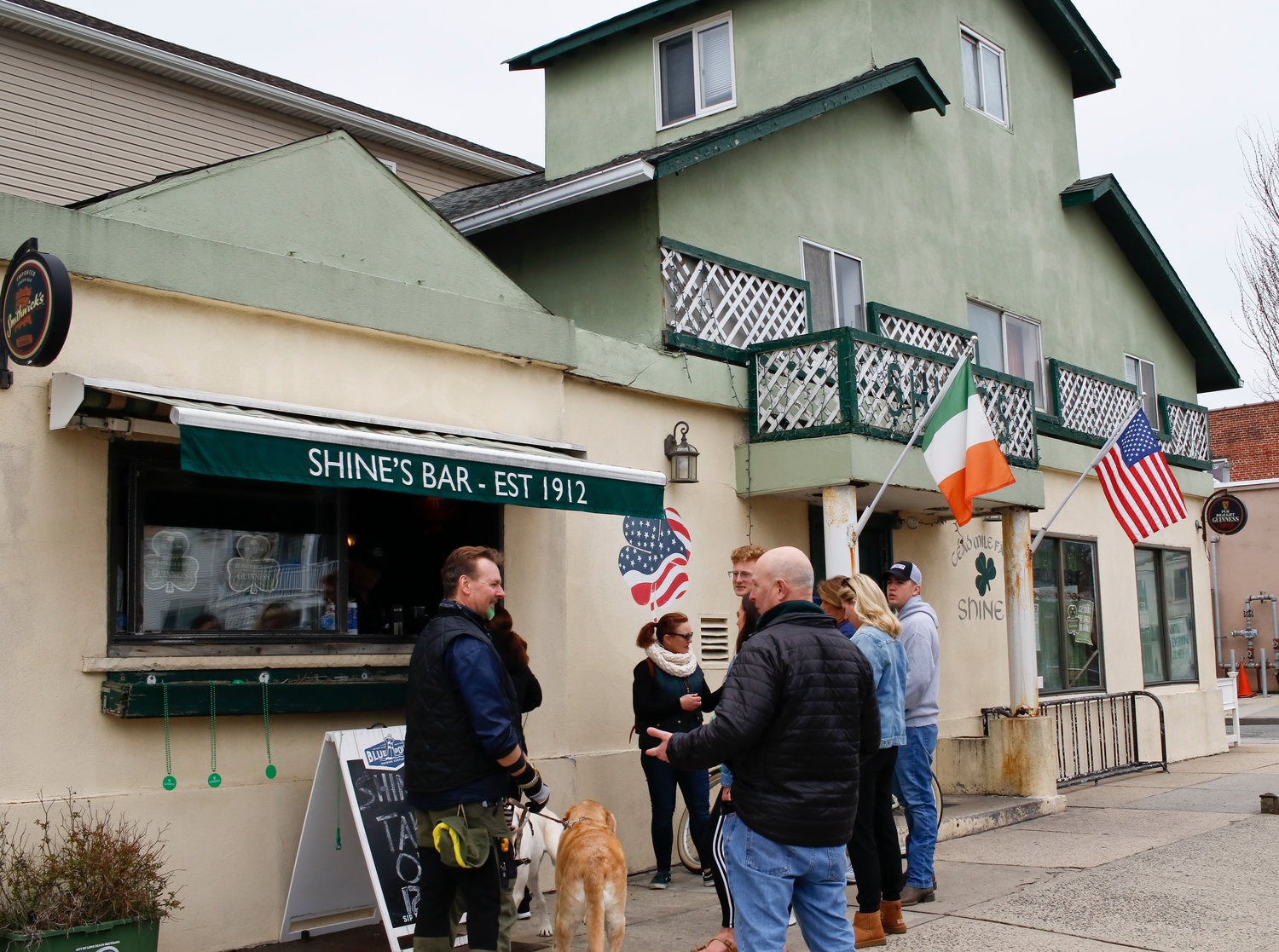 Patrons had to eat and drink St. Patrick’s Day food outside Shine’s amid state-ordered coronavirus closings.