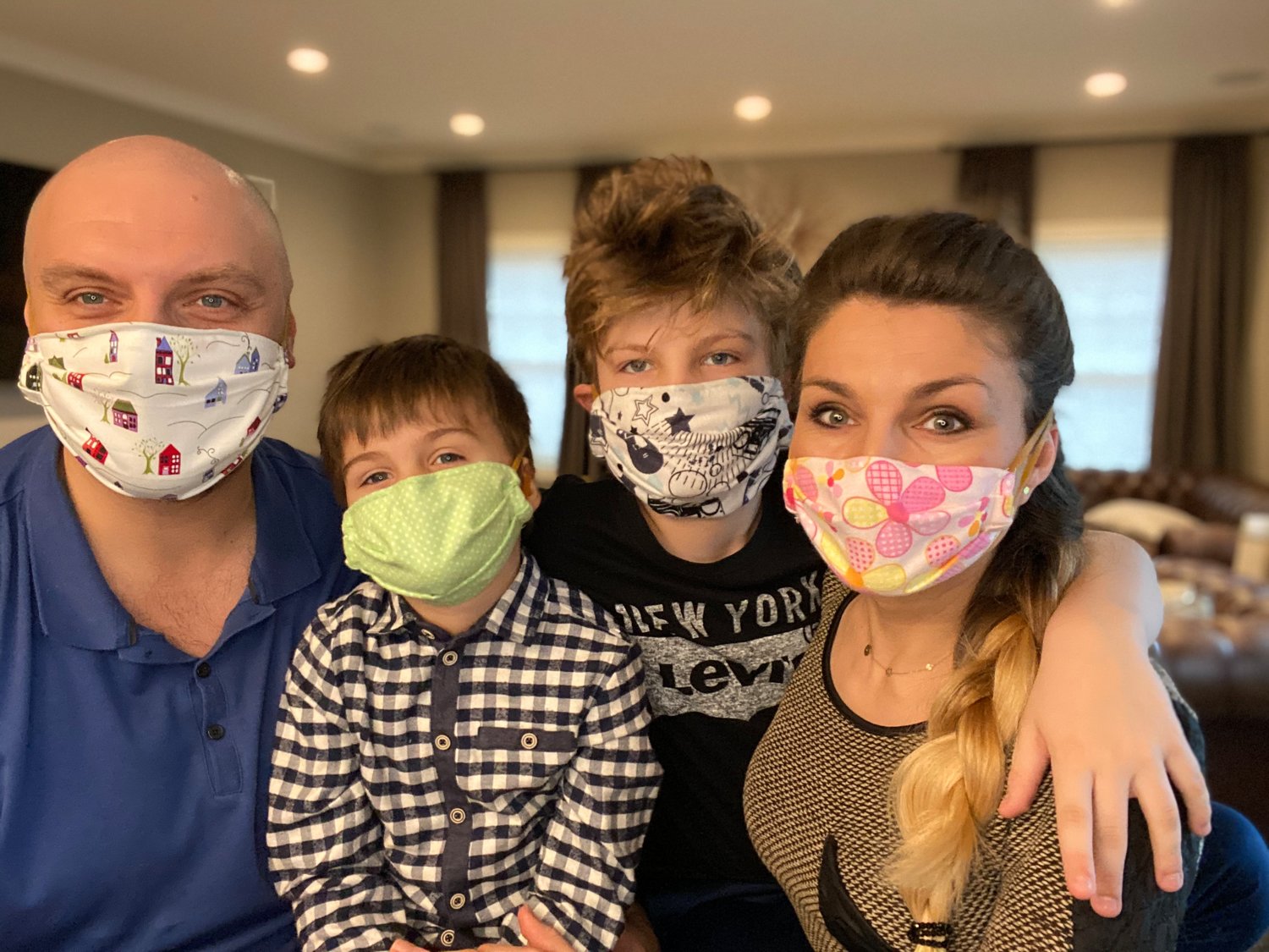 The Karolak family — from left, Chris, Konrad, Viktor and Basha — have spent quarantine sewing masks for essential workers.