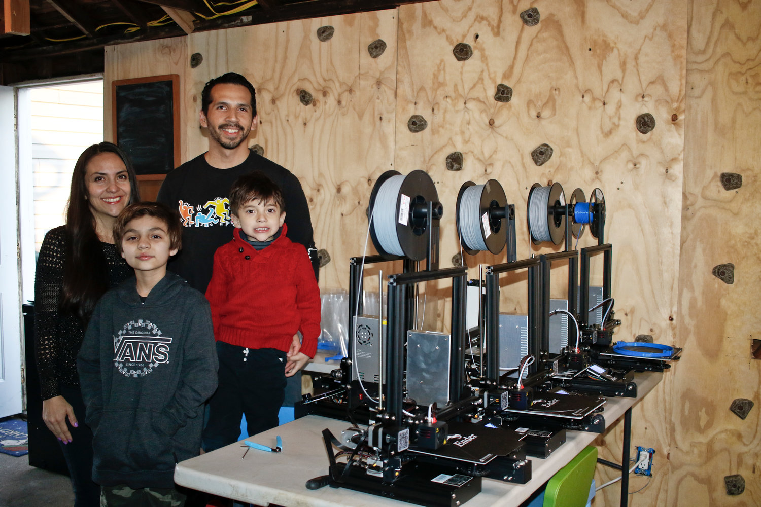 Andrea and Rich Rengel and their sons, Sebastian, 10, and Oliver, 4, converted their garage into a 3D printing workshop to build face shields for local healthcare workers.