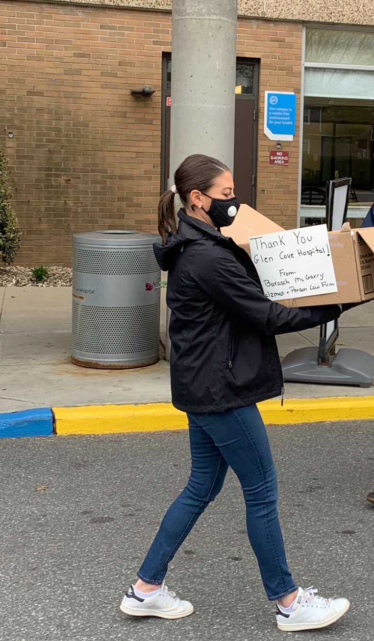 Sara Director, an attorney with the Barasch McGarry Law Firm, delivered lunches to Glen Cove Hospital, where she volunteered as a teenager. Director grew up in Glen Cove and now resides in Locust Valley.