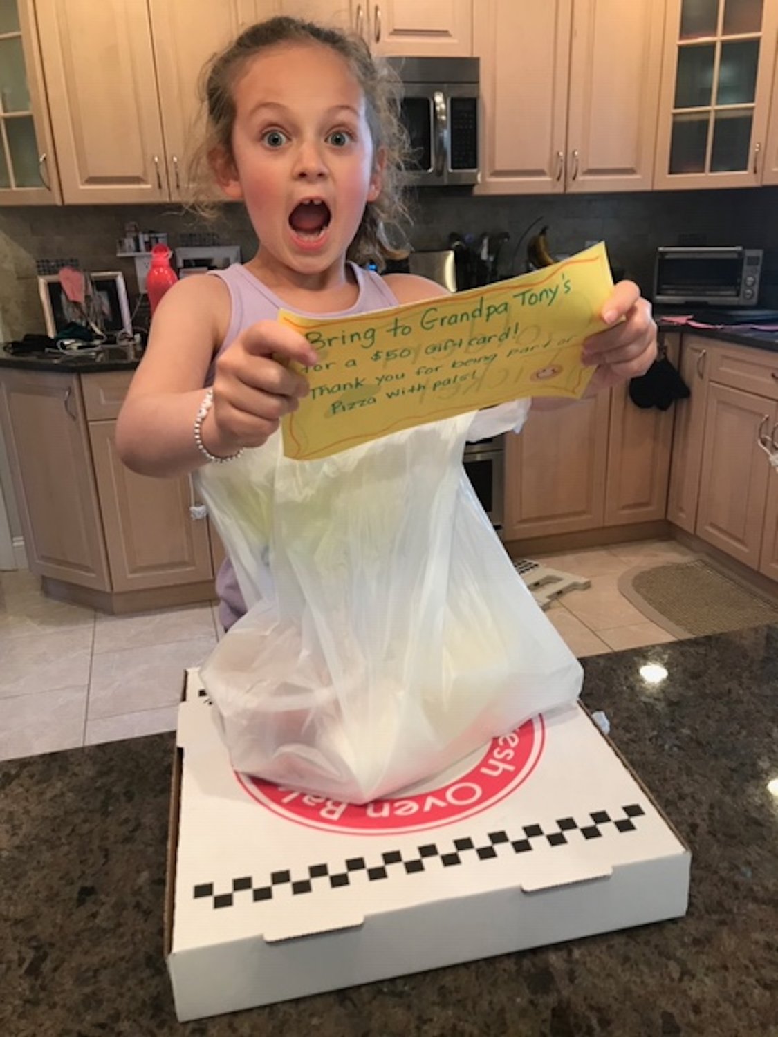 Mackenzie McCabe earned a “golden ticket” for a $50 gift card to Grandpa Tony’s, which hosted a virtual pizza party on May 15.