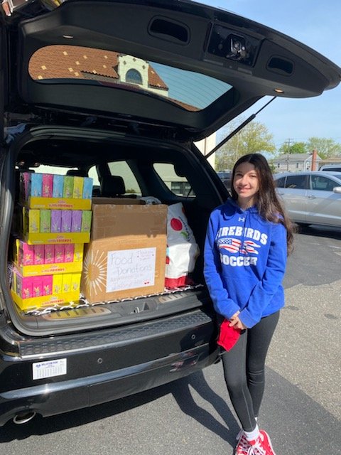 Malverne teen Sophia Negrino collected food for Our Lady of Lourdes Churches’ food pantry on May 19.