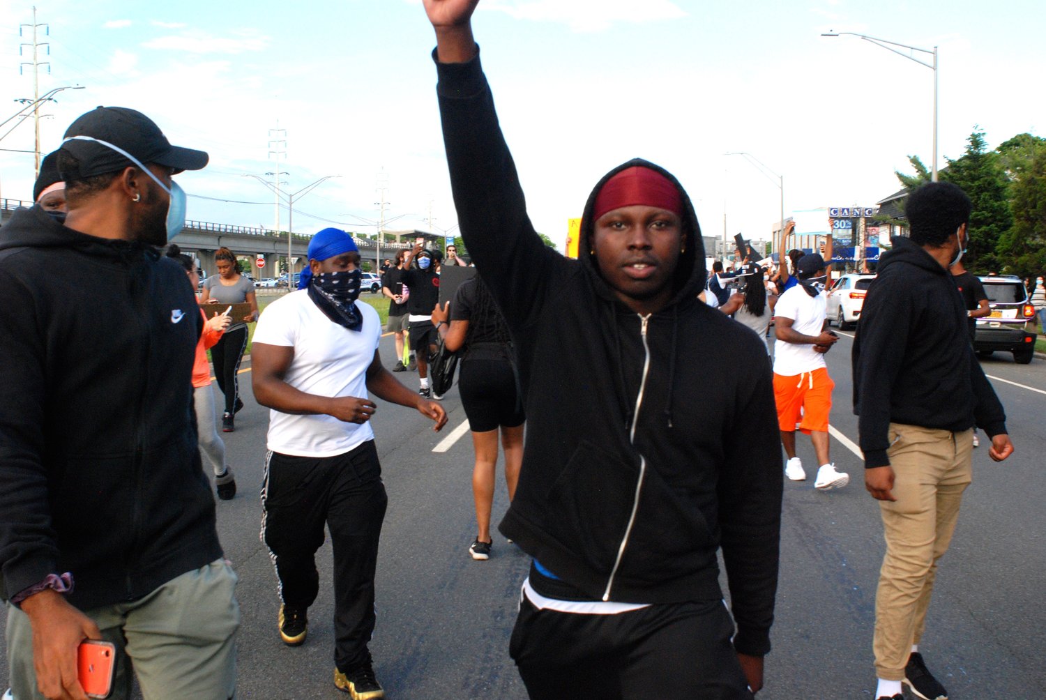 Many demonstrators marched with their arms held high.