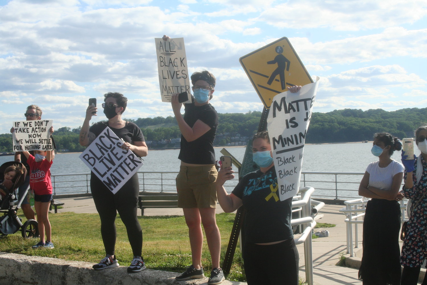 Some Sea Cliff residents stood beside Sea Cliff Beach to show their support.