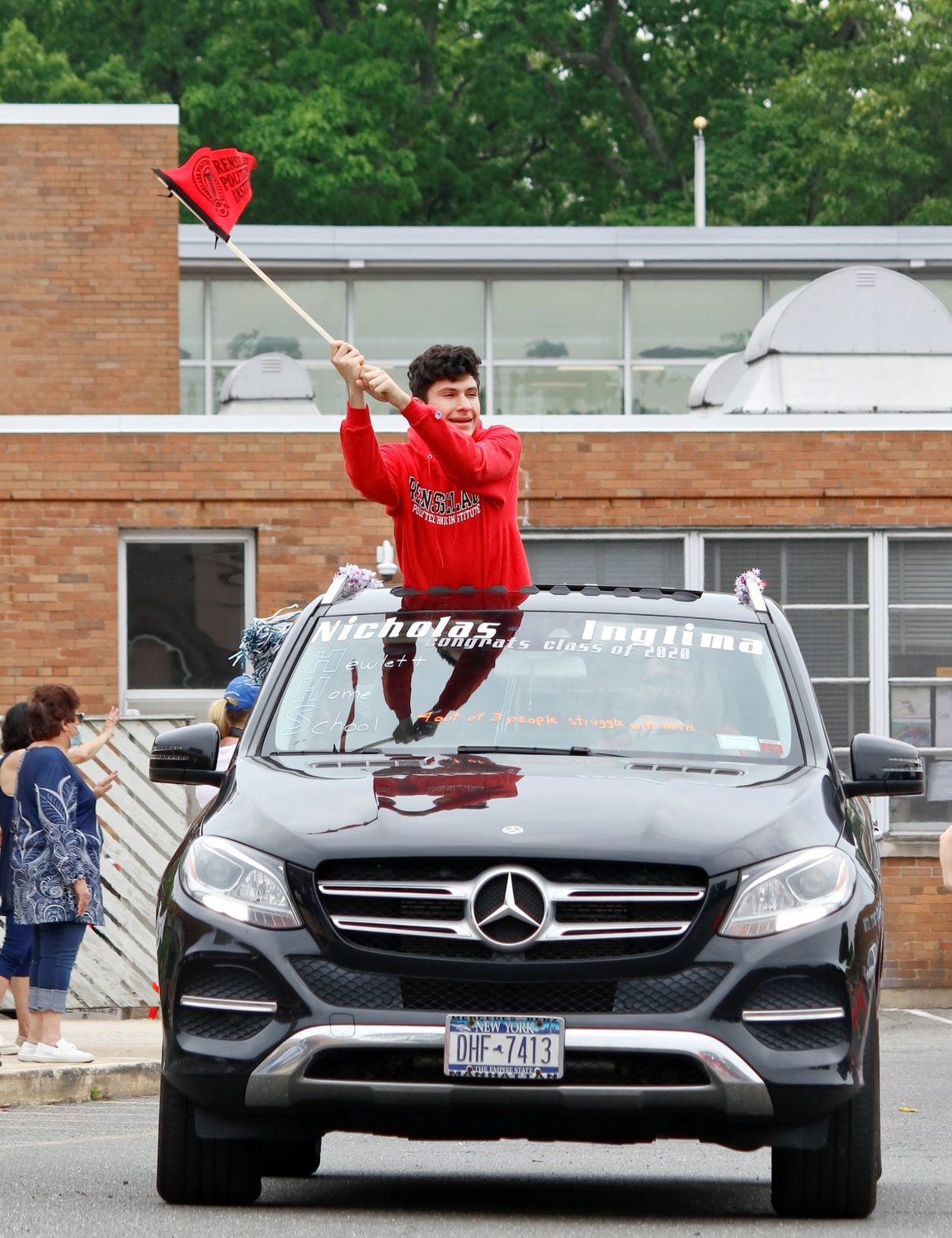 Hewlett High School graduate Nicholas Inglima celebrated during the vehicle caravan on June 5.