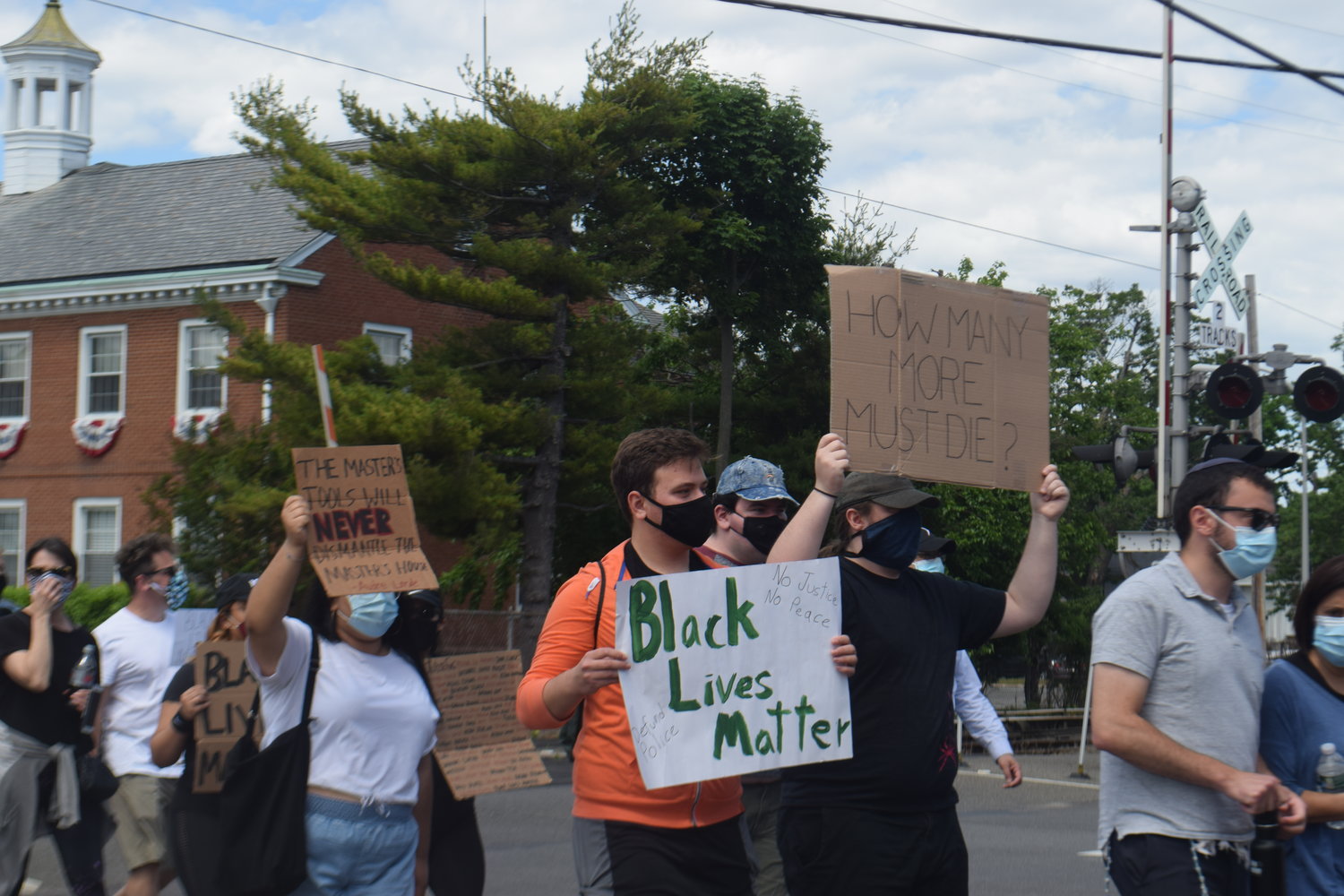 Marchers headed up Cedarhurst Avenue, toward Central Avenue in Cedarhurst on June 7.