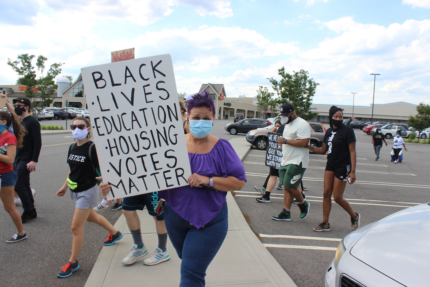 Protesters began at the East Meadow Mall before heading west on Front Street.