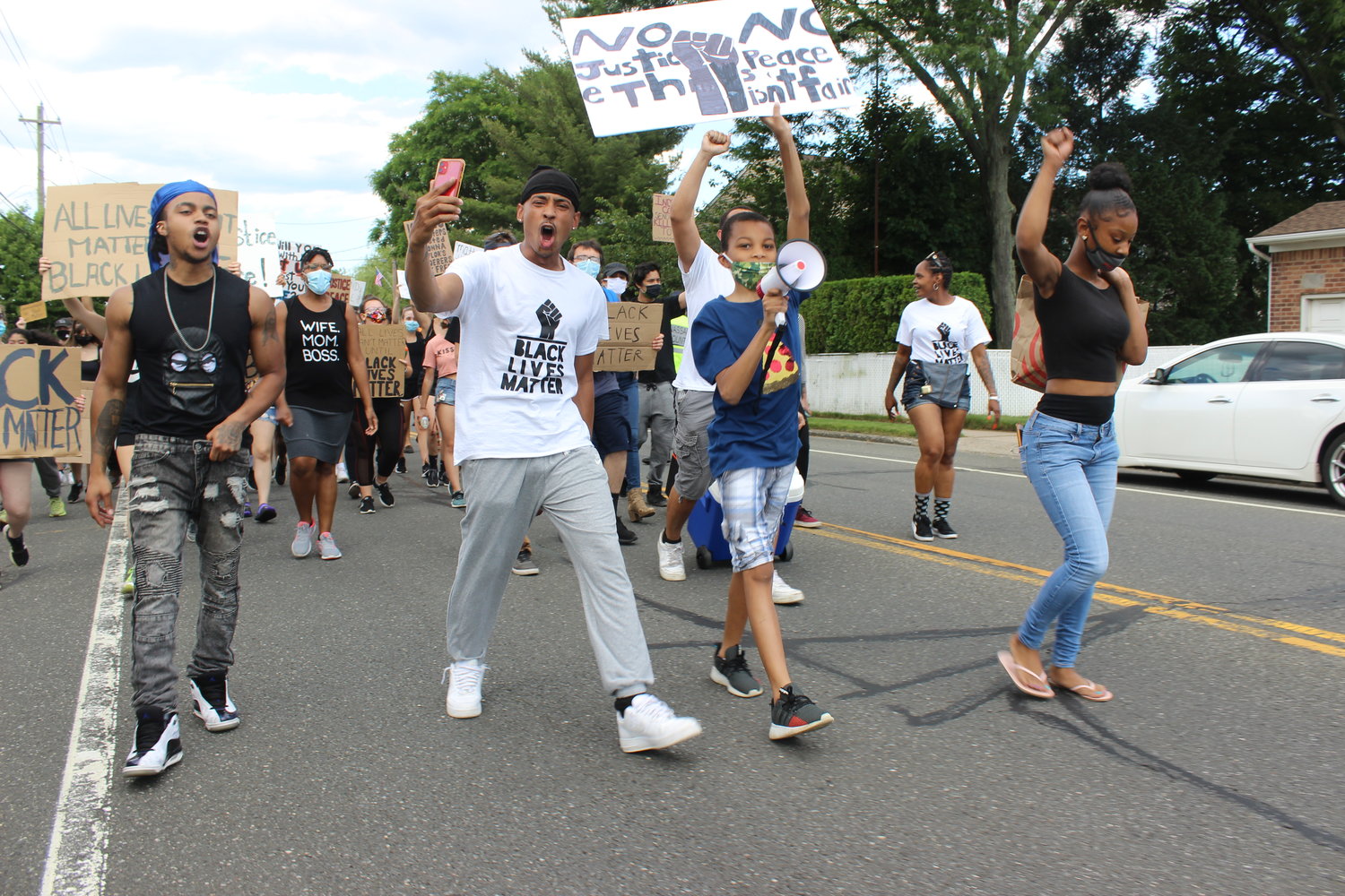 In the two hours leading to the arrests, Tuosto and his fellow co-organizers marched with hundreds of protesters from Front Street to Merrick Avenue and down Hempstead Turnpike.